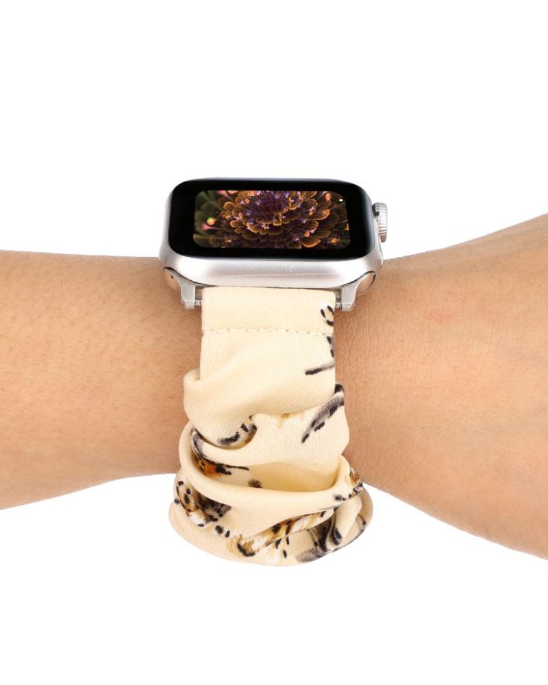 Beige leopard print scrunchie loop fabric band on Apple Watch wrist