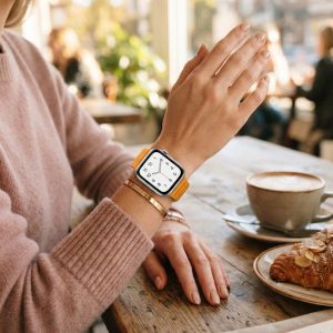 Model wearing California Poppy Leather Link Band for Apple Watch Apple Watch band