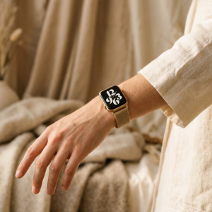 Model wearing Champagne Light Gold Aurora Slim Milanese Band for Apple Watch Apple Watch band
