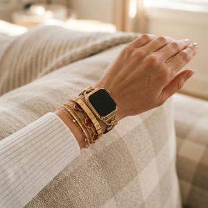 Model wearing Dakota Hybrid Steel Leather Band for Apple Watch in Gold and Black Leather Apple Watch band