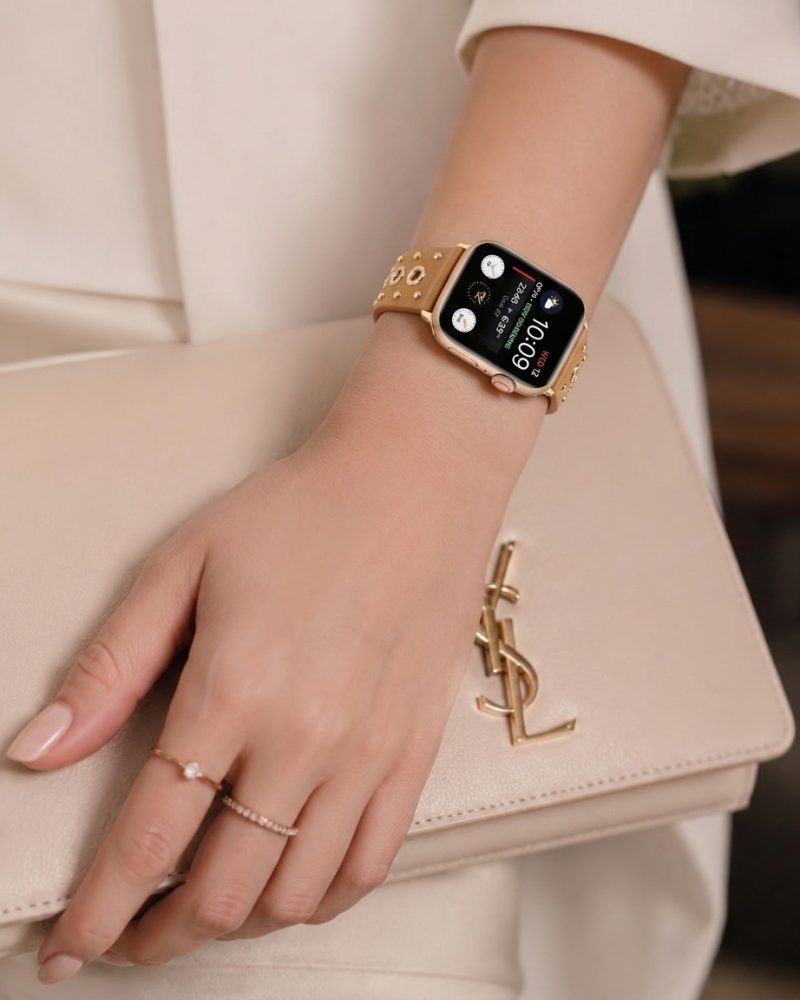 Model wearing Elektra Leather Band with Gold Rivets for Apple Watch in Brown Apple Watch band