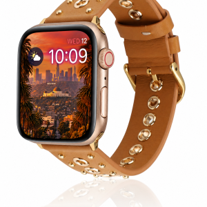 Model wearing Elektra Leather Band with Gold Rivets for Apple Watch in Brown Apple Watch band
