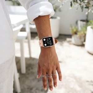 Model wearing Elektra Leather Band with Rose Gold Rivets for Apple Watch in Pink Apple Watch band
