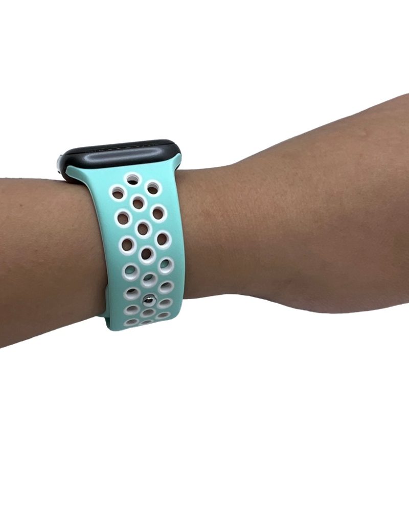 Marine teal and white perforated silicone Apple Watch sport band worn on wrist