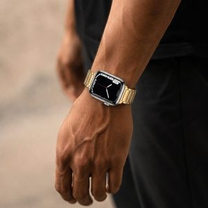 Model wearing Maximus Magnetic Stainless Steel Band for Apple Watch in Gold Apple Watch band