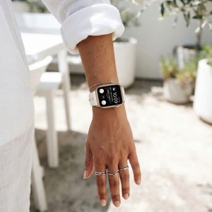 Model wearing Shakira Leather Band with Gold Studs for Apple Watch in Beige Apple Watch band