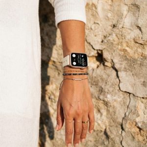 Model wearing Shakira Leather Band with Gold Studs for Apple Watch in Beige Apple Watch band