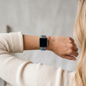 Model wearing Stripe Light Red With Gray Lake Green Lake Blue Milanese Loop For Apple Watch Apple Watch band