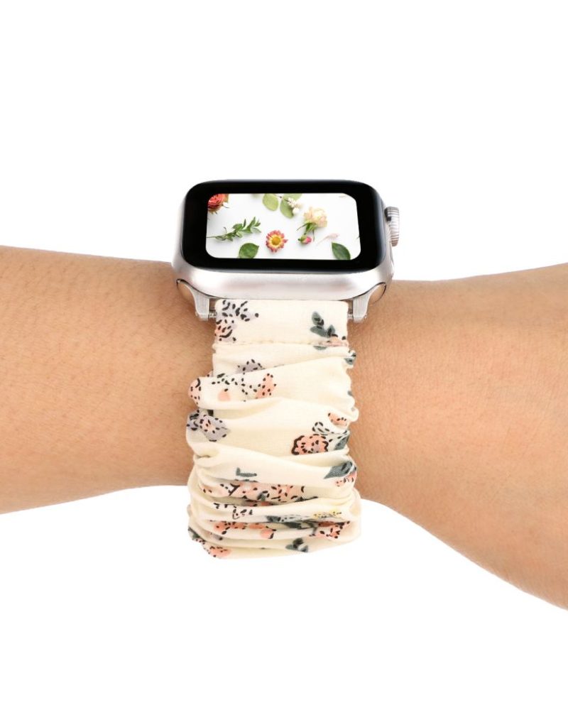 White floral scrunchie loop band for Apple Watch worn on wrist