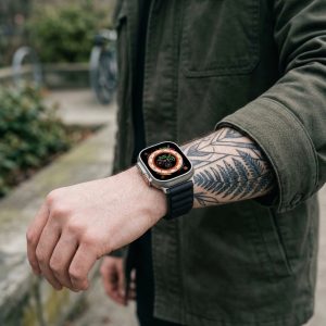 Model wearing Alpine Loop Band For Apple Watch in Black Apple Watch band