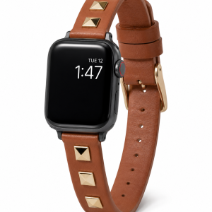 Model wearing Rockstar Slim Leather Band with Gold Studs for Apple Watch in Saddle Brown Apple Watch band