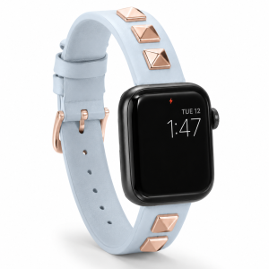Model wearing Rockstar Slim Leather Band with Rose Gold Studs for Apple Watch in Light Blue Apple Watch band
