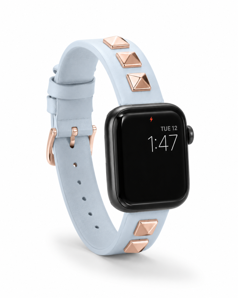 Model wearing Rockstar Slim Leather Band with Rose Gold Studs for Apple Watch in Light Blue Apple Watch band